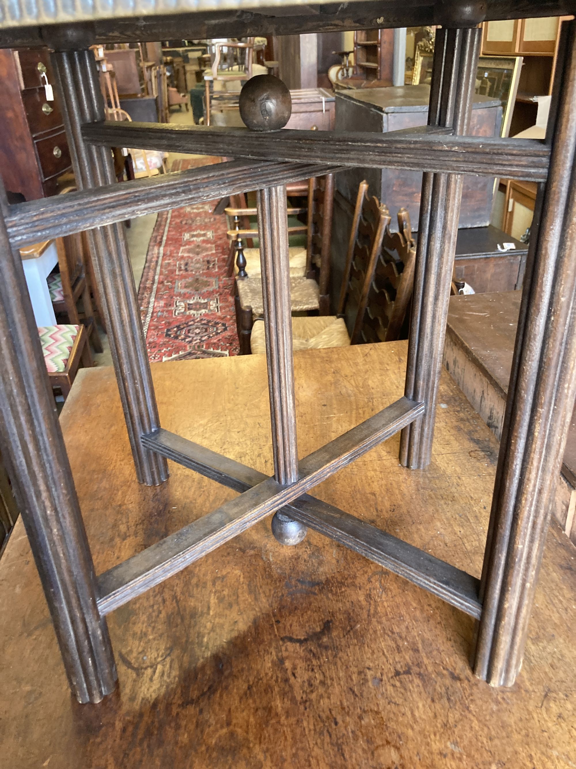 A Benares circular brass tray top occasional table, diameter 59cm, height 58cm Diam.60cm